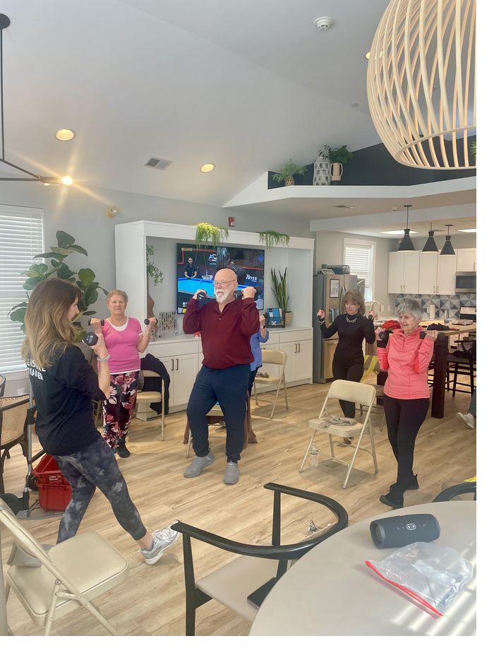 Senior fitness class with dumbbells